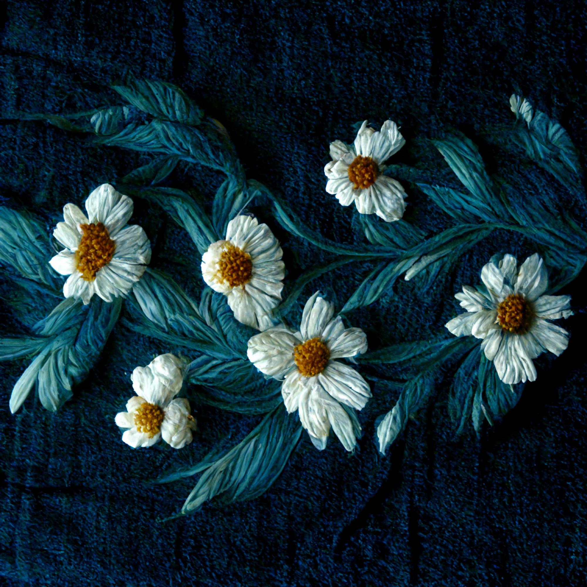 Embroidered denim patch with floral motif