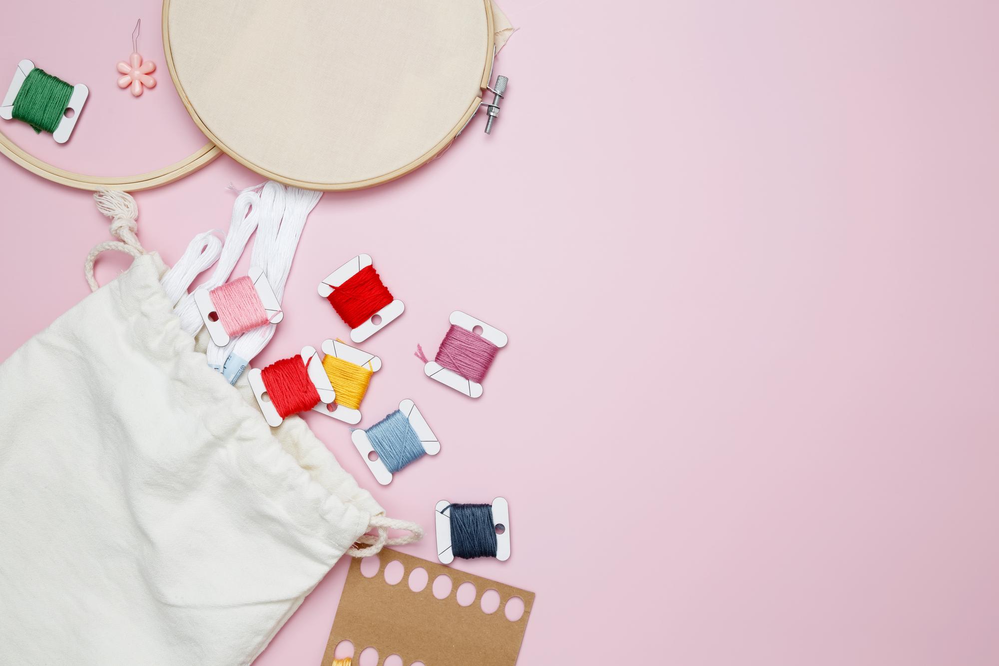 Flatlay of embroidered swatches and planning notes
